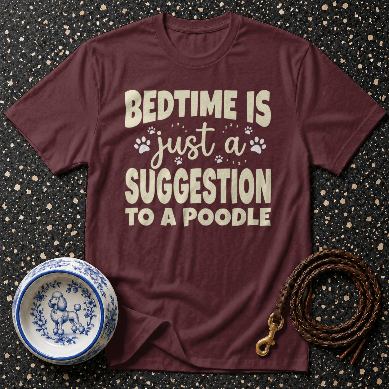 Maroon t-shirt with "Bedtime is just a suggestion to a poodle" text and poodle decor.