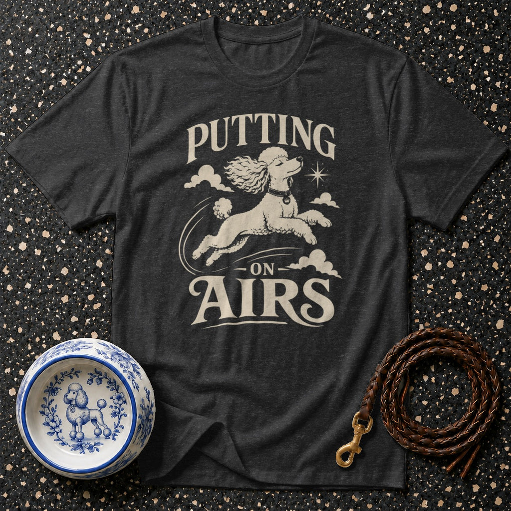 Dark grey t-shirt with poodle graphic and text "PUTTING ON AIRS"