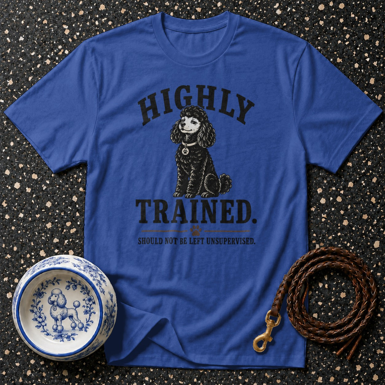 Blue t-shirt with "HIGHLY TRAINED. SHOULD NOT BE LEFT UNSUPERVISED." text and poodle graphic.