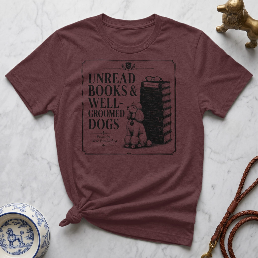 Burgundy t-shirt with stacked books, glasses, and poodle illustration and "Unread Books & Well-Groomed Dogs" text.
