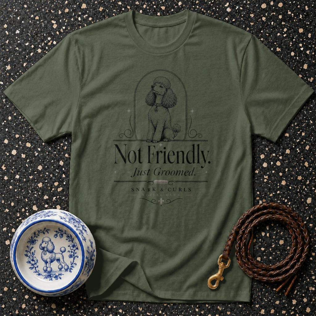 Green t-shirt with "Not Friendly. Just Groomed." text and poodle graphic.