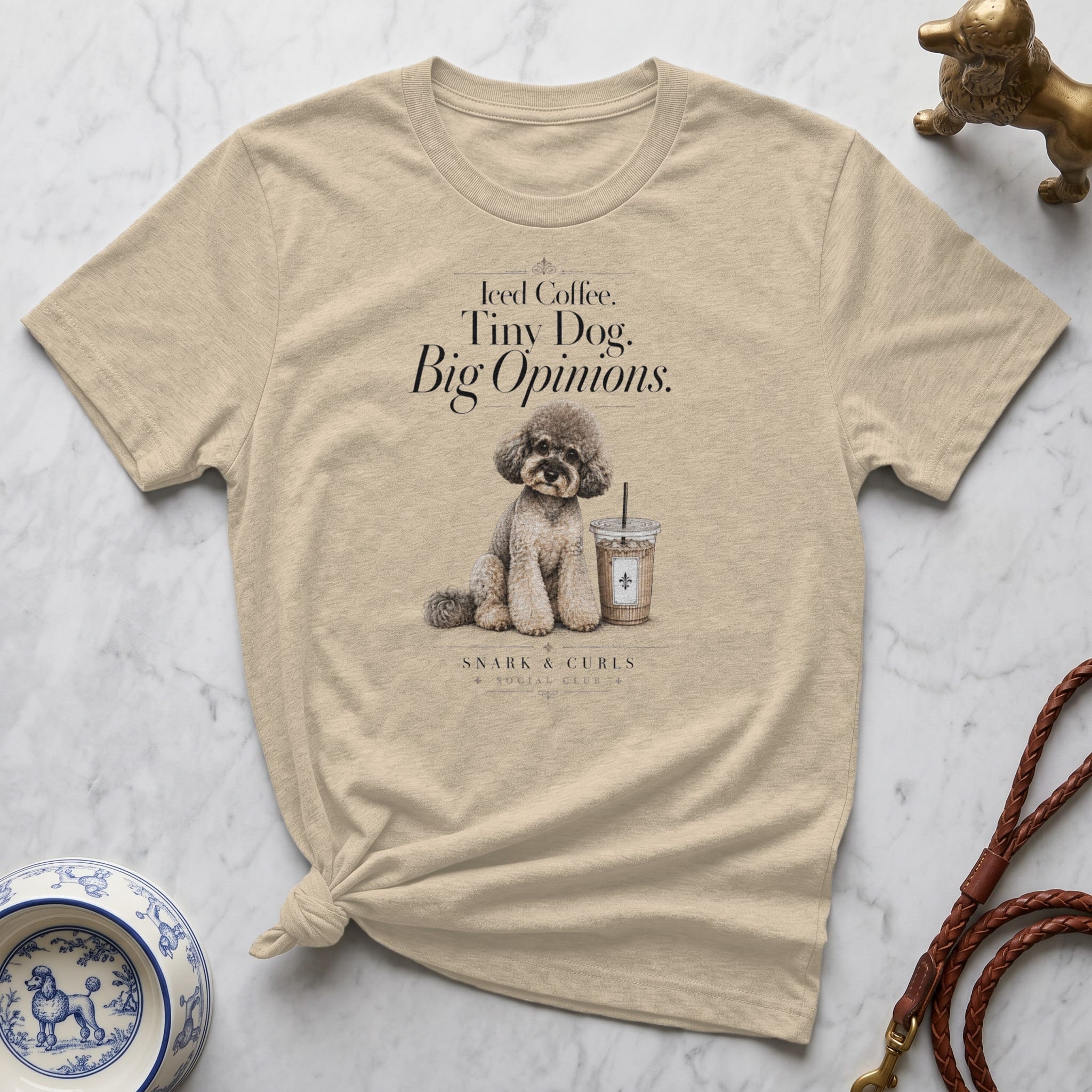 Cream t-shirt with illustration of a poodle, coffee cup, and text "Iced Coffee. Tiny Dog. Big Opinions."