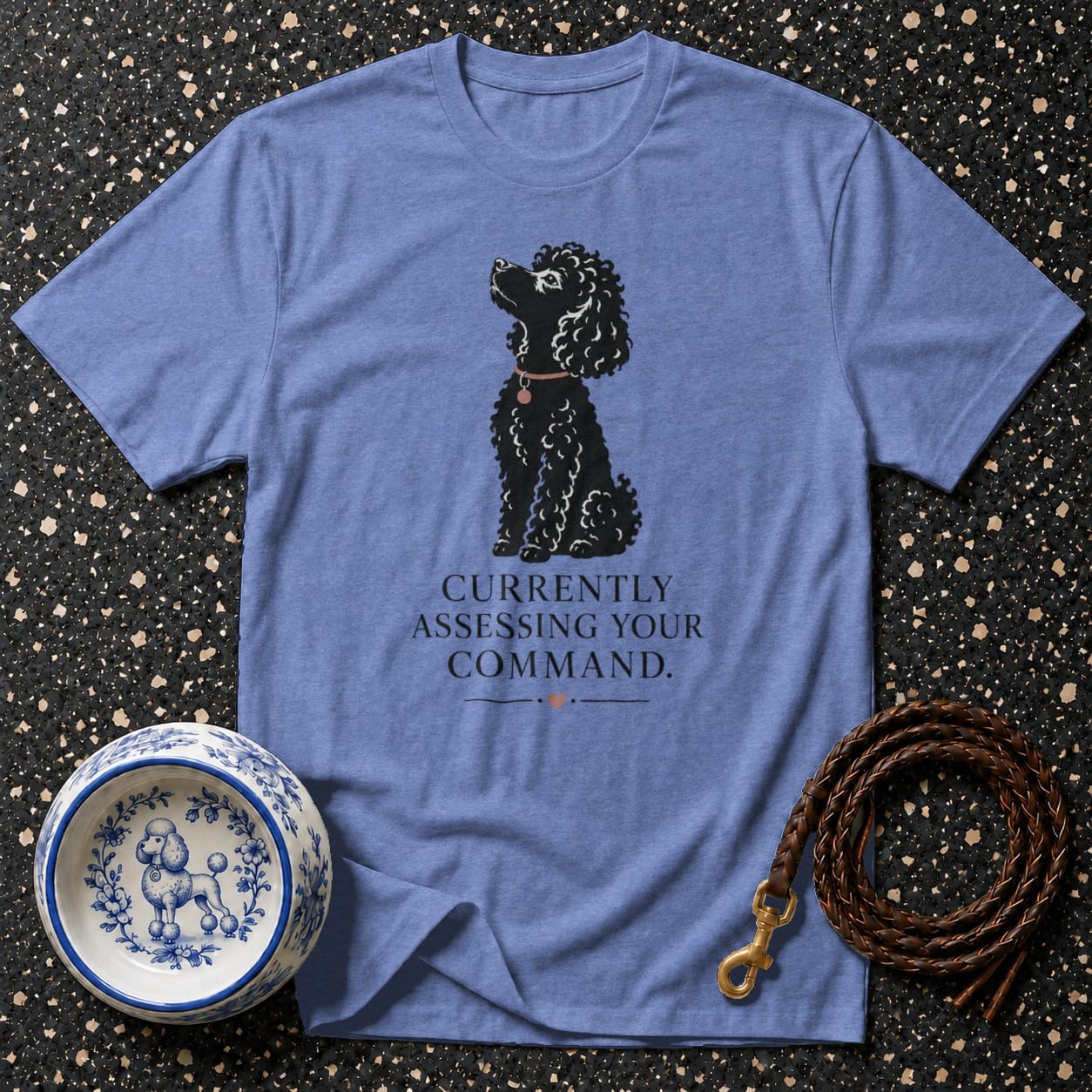 Blue t-shirt with black poodle graphic and "Currently Assessing Your Command" text.