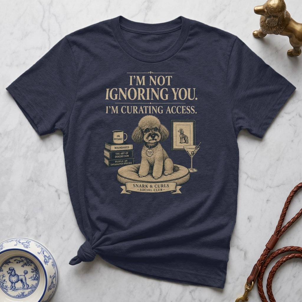 Navy t-shirt with poodle illustration and text "I'M NOT IGNORING YOU. I'M CURATING ACCESS."