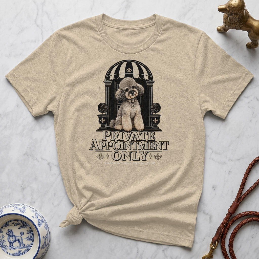 Tan t-shirt with graphic of a poodle by a doorway and "Private Appointment" text.