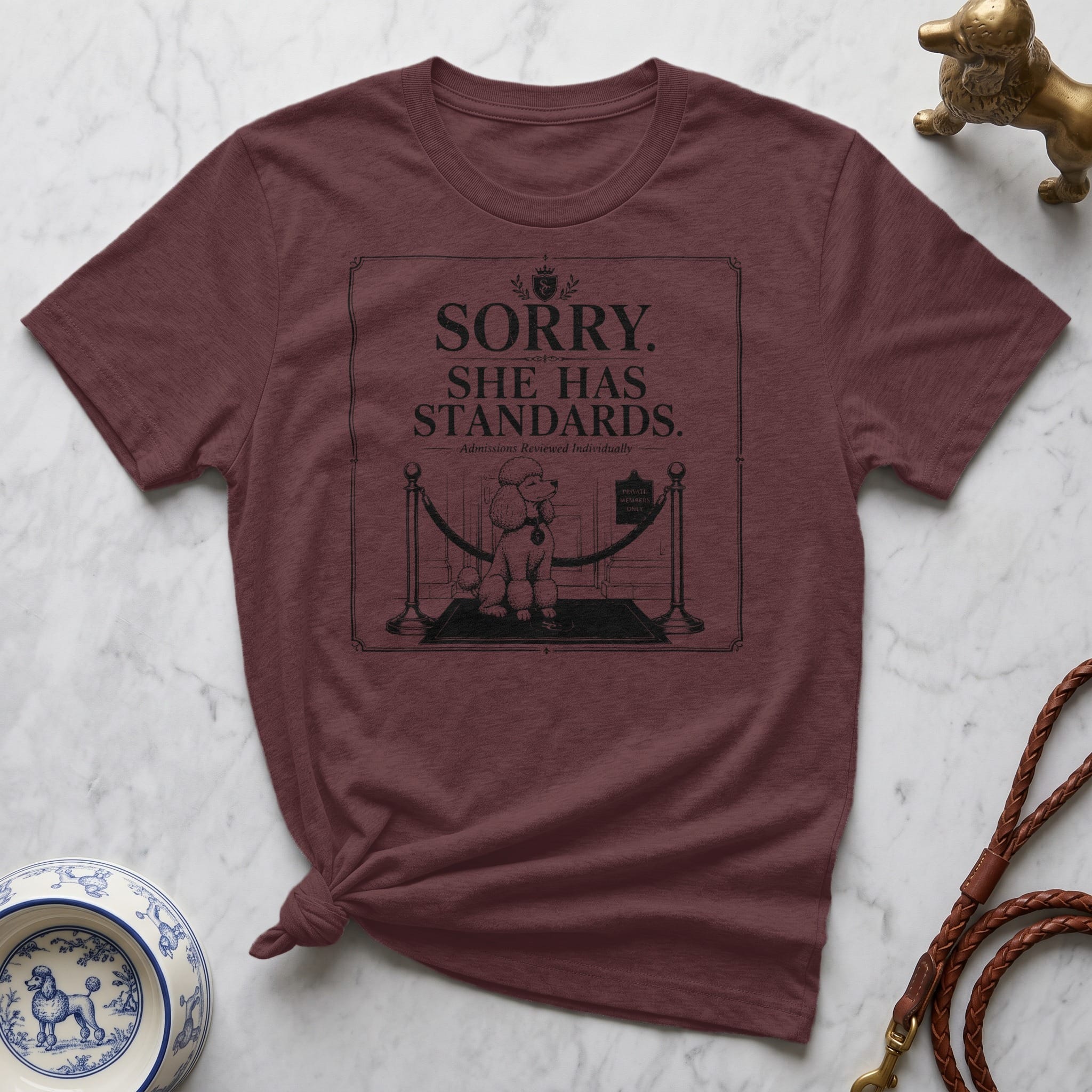 Maroon t-shirt with "Sorry. She has standards." text and poodle graphic.