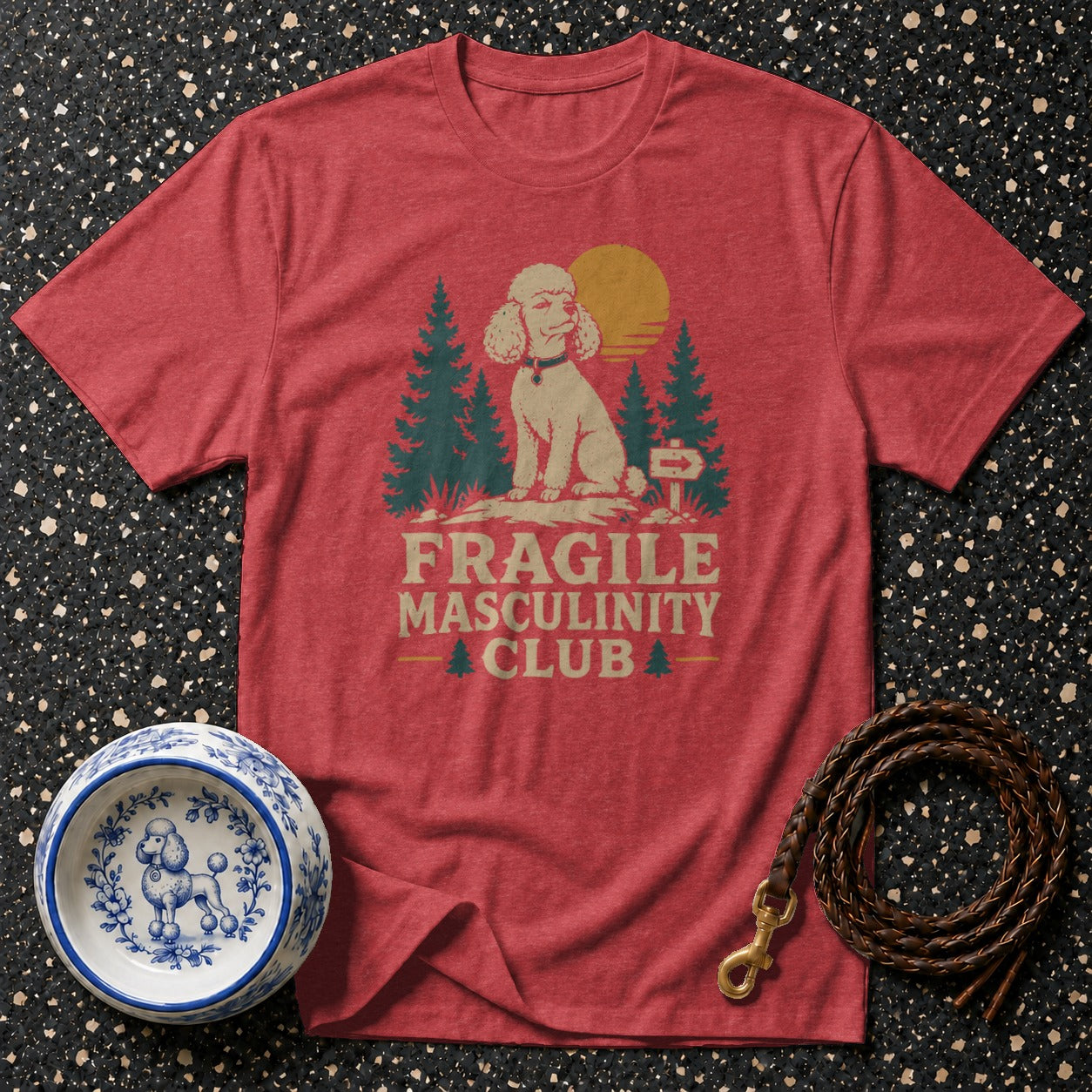 Red t-shirt with a poodle and "Fragile Masculinity Club" text graphic.