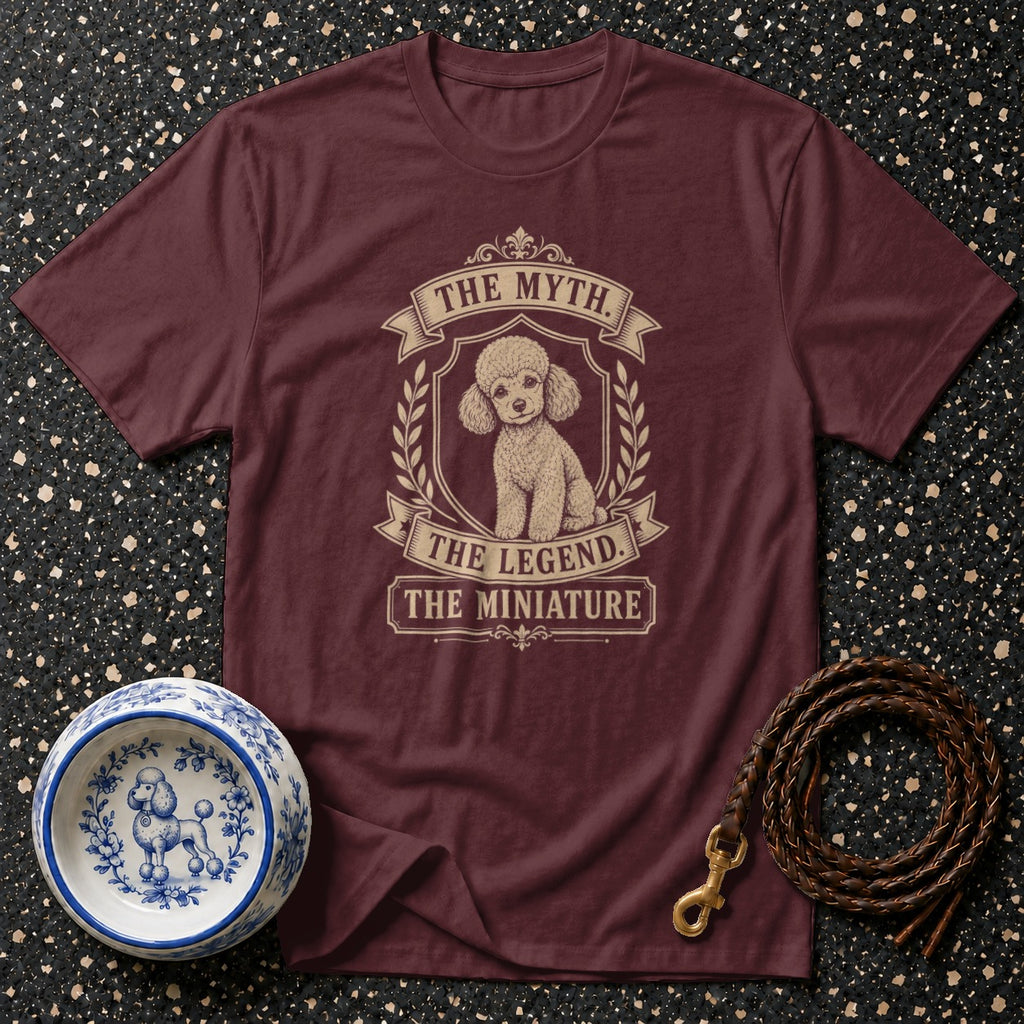 Maroon t-shirt with a poodle illustration and text reading "The Myth. The Legend. The Miniature."