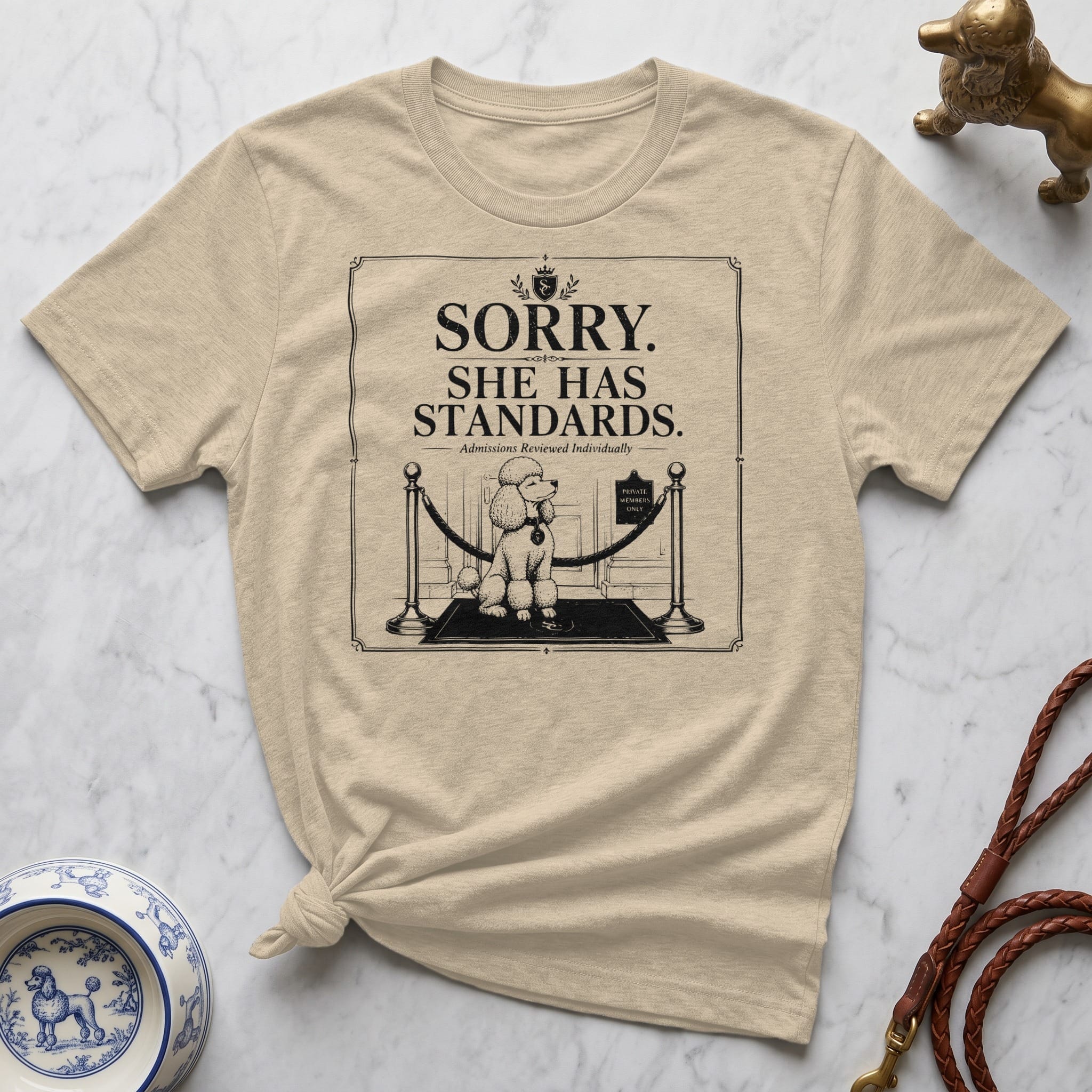 T-shirt with a poodle behind velvet ropes and the text "Sorry, she has standards."