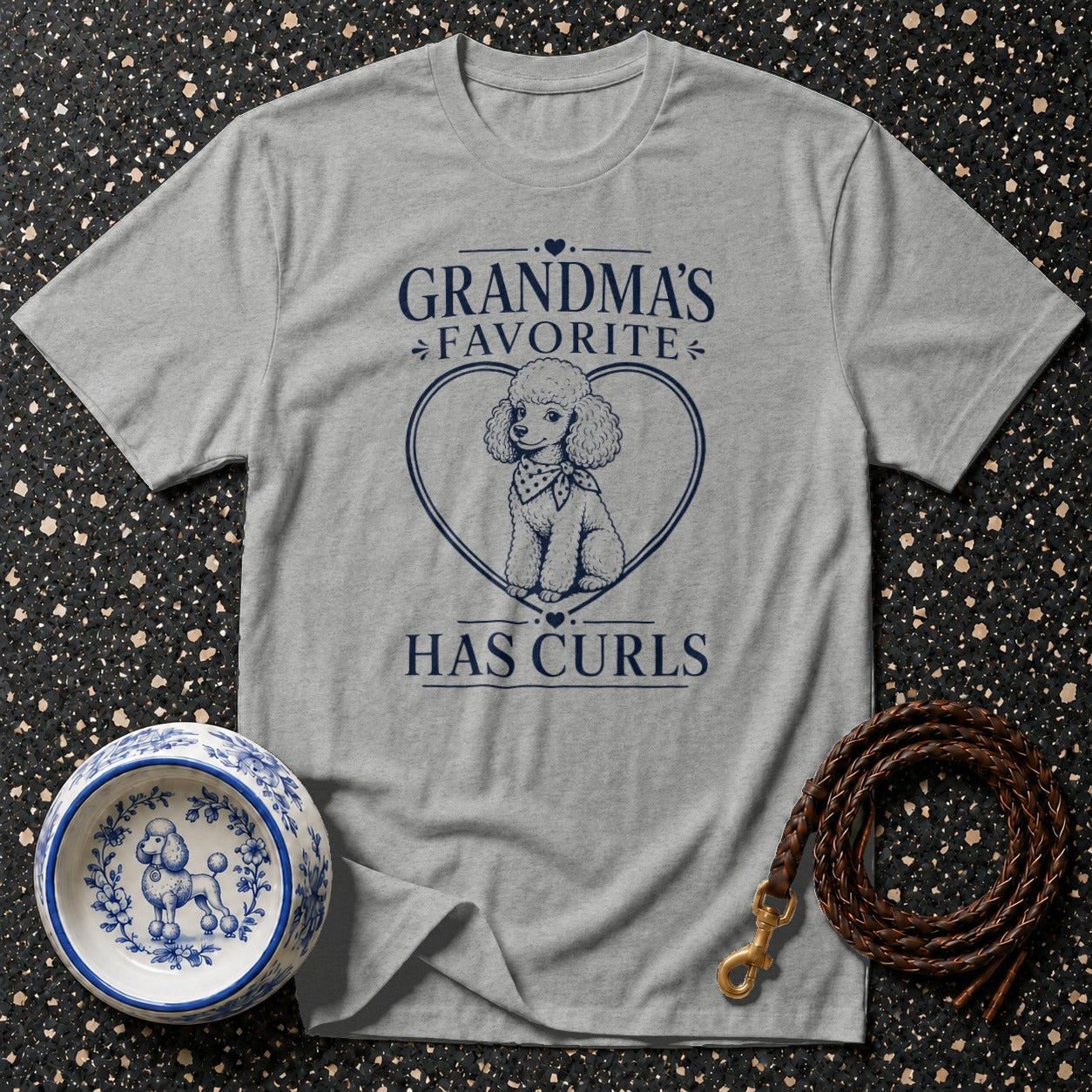 Gray t-shirt with navy blue text and poodle graphic: "GRANDMA'S FAVORITE HAS CURLS"