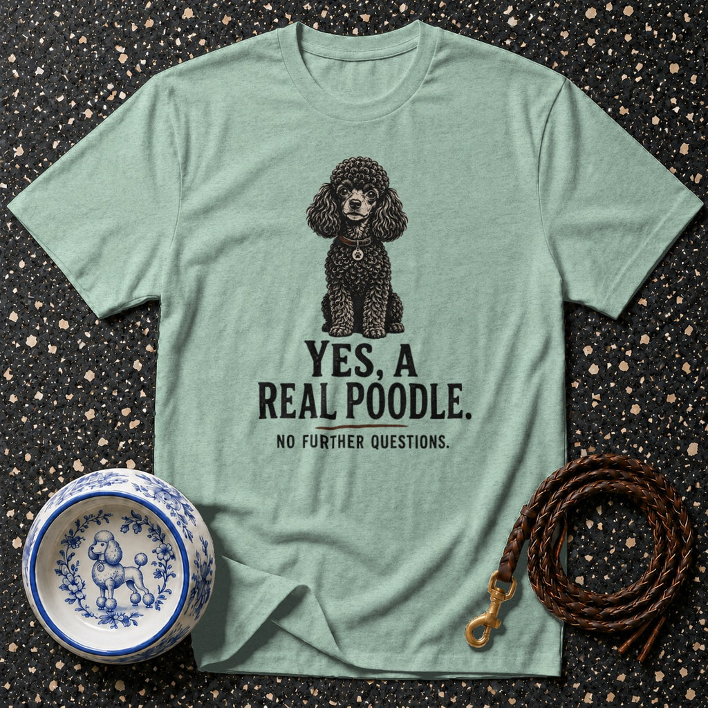 Light green t-shirt with a black poodle illustration and text reading "YES, A REAL POODLE."