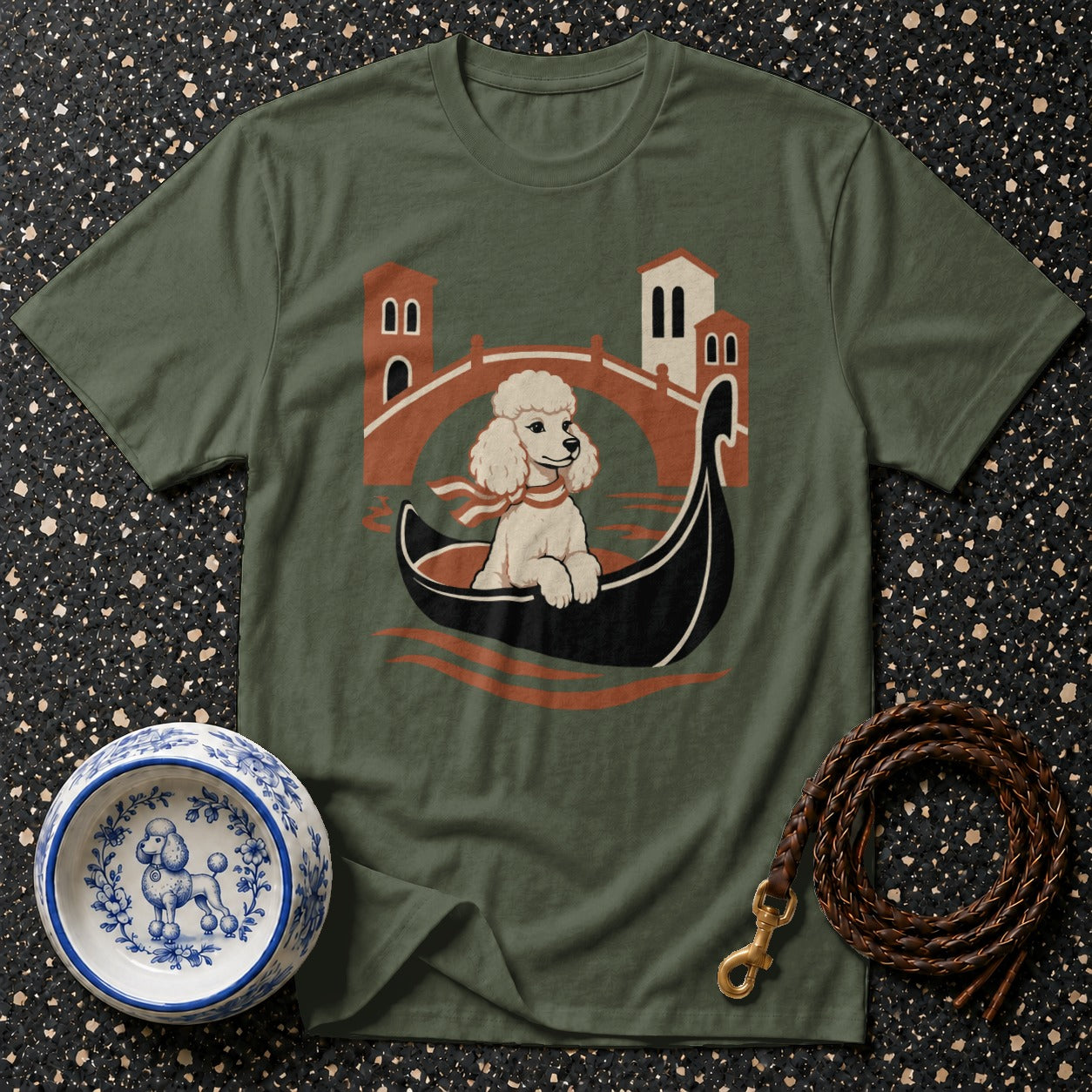 Green t-shirt with a cartoon poodle in a gondola in front of a Venetian bridge.