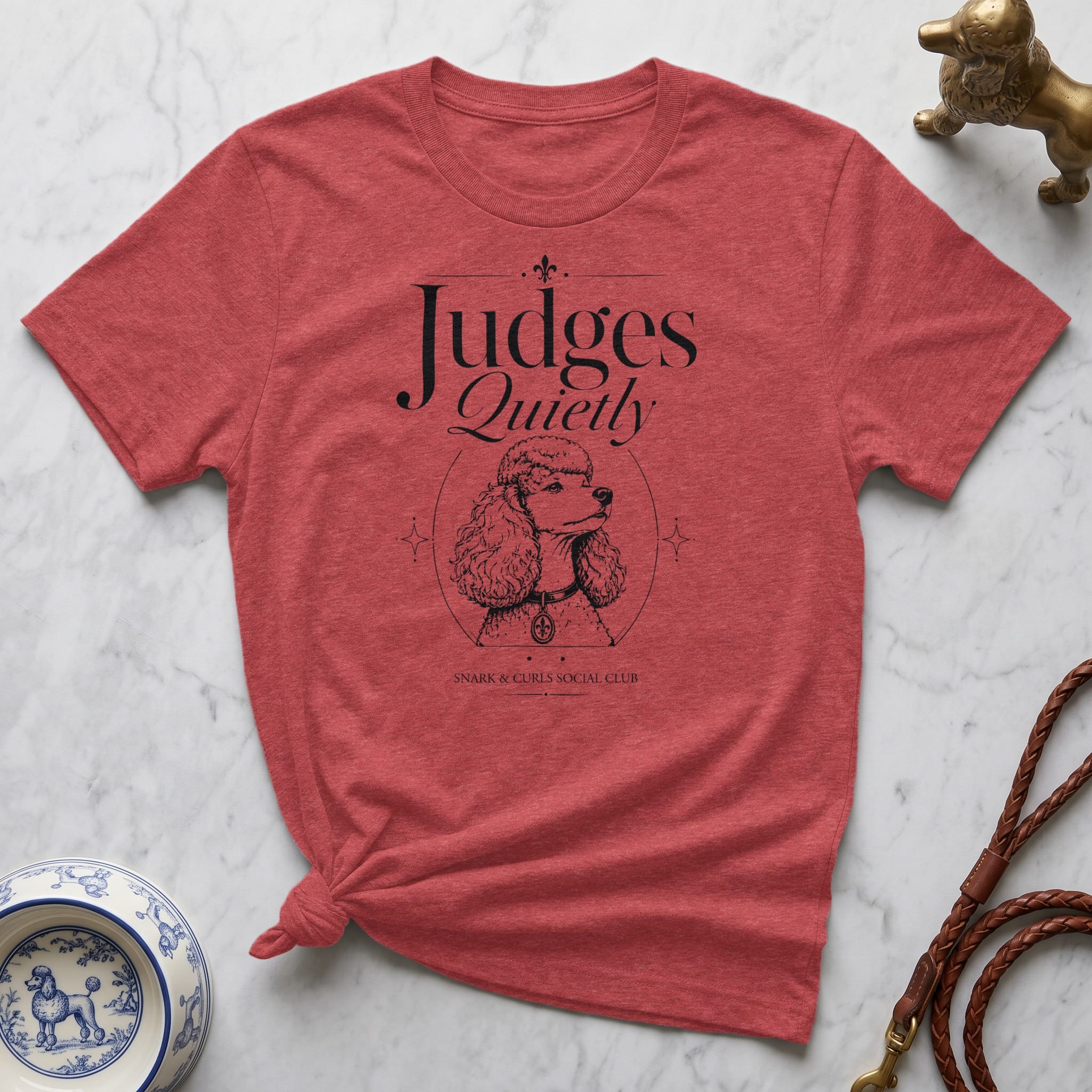 Red t-shirt with "Judges Quietly" and a poodle illustration.