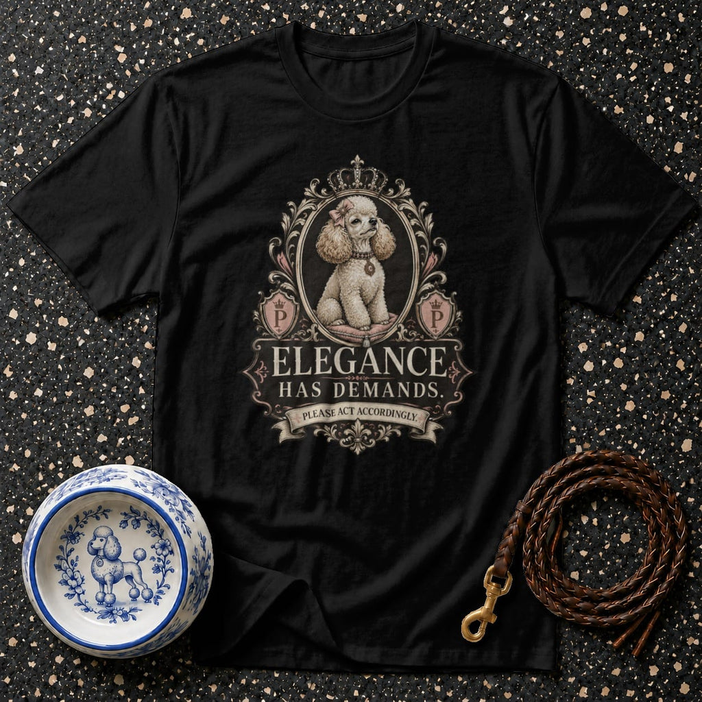 Black t-shirt featuring a poodle in a decorative frame with the text "Elegance Has Demands."