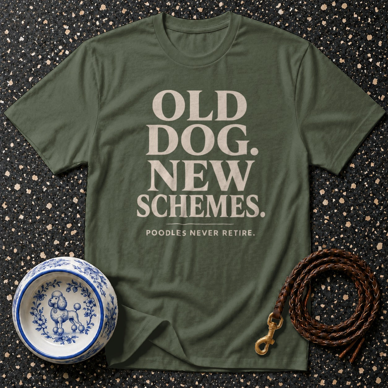 Green t-shirt with text "OLD DOG. NEW SCHEMES. POODLES NEVER RETIRE."
