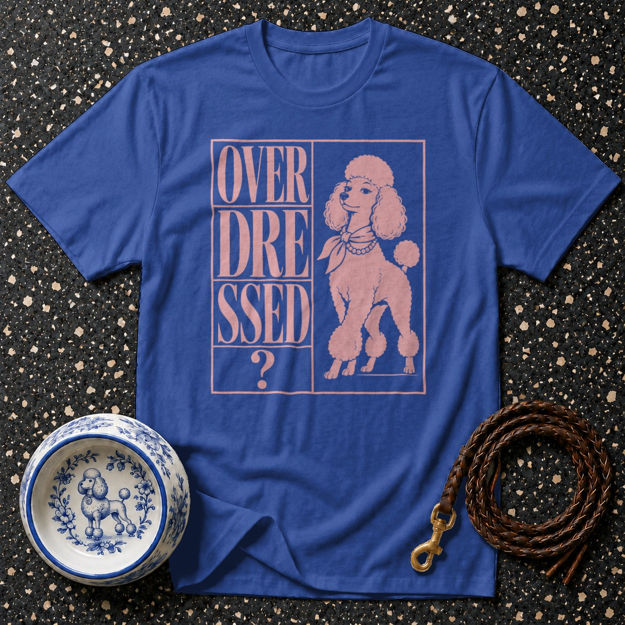Blue t-shirt with pink text "OVER DRESSED ?" and poodle graphic.