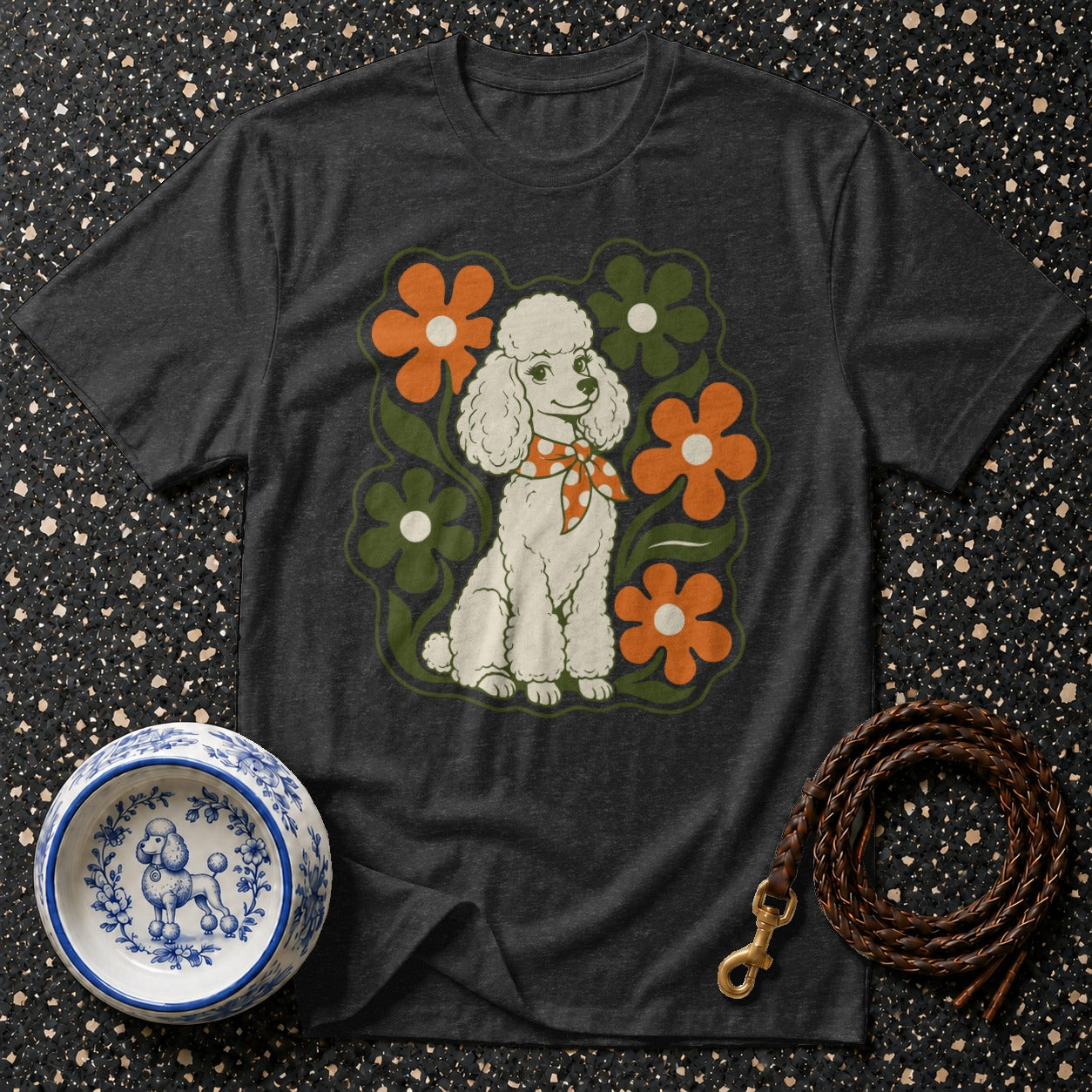 Dark gray t-shirt with a white poodle graphic surrounded by retro flowers.