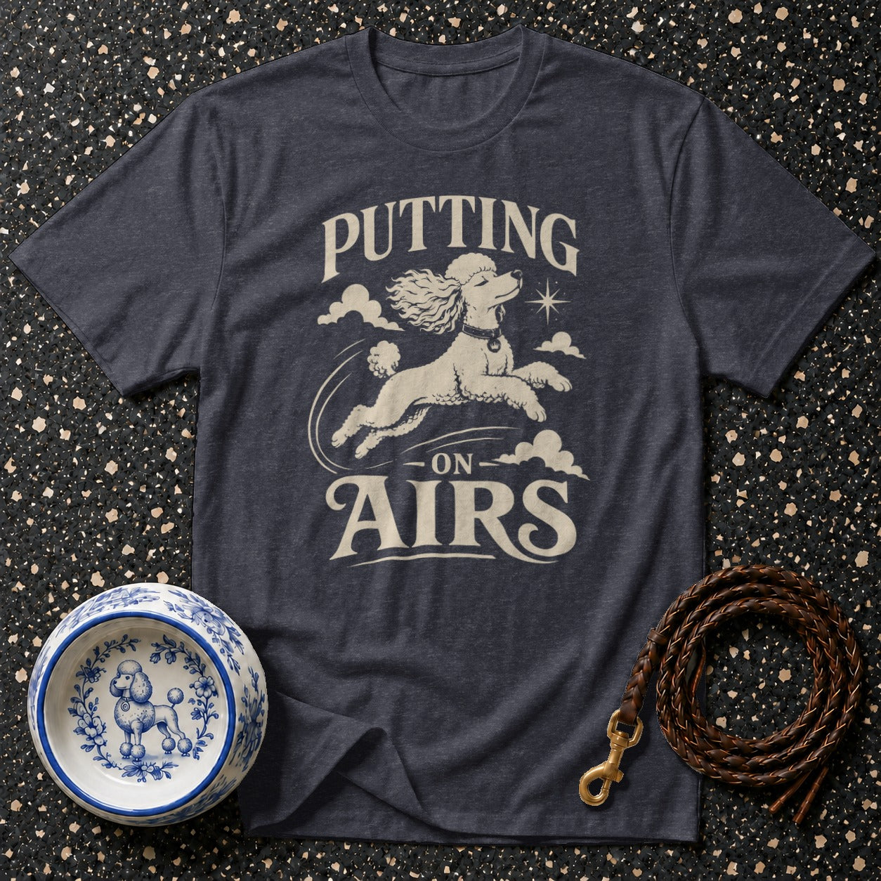 Dark grey t-shirt with poodle graphic and "Putting on Airs" text.