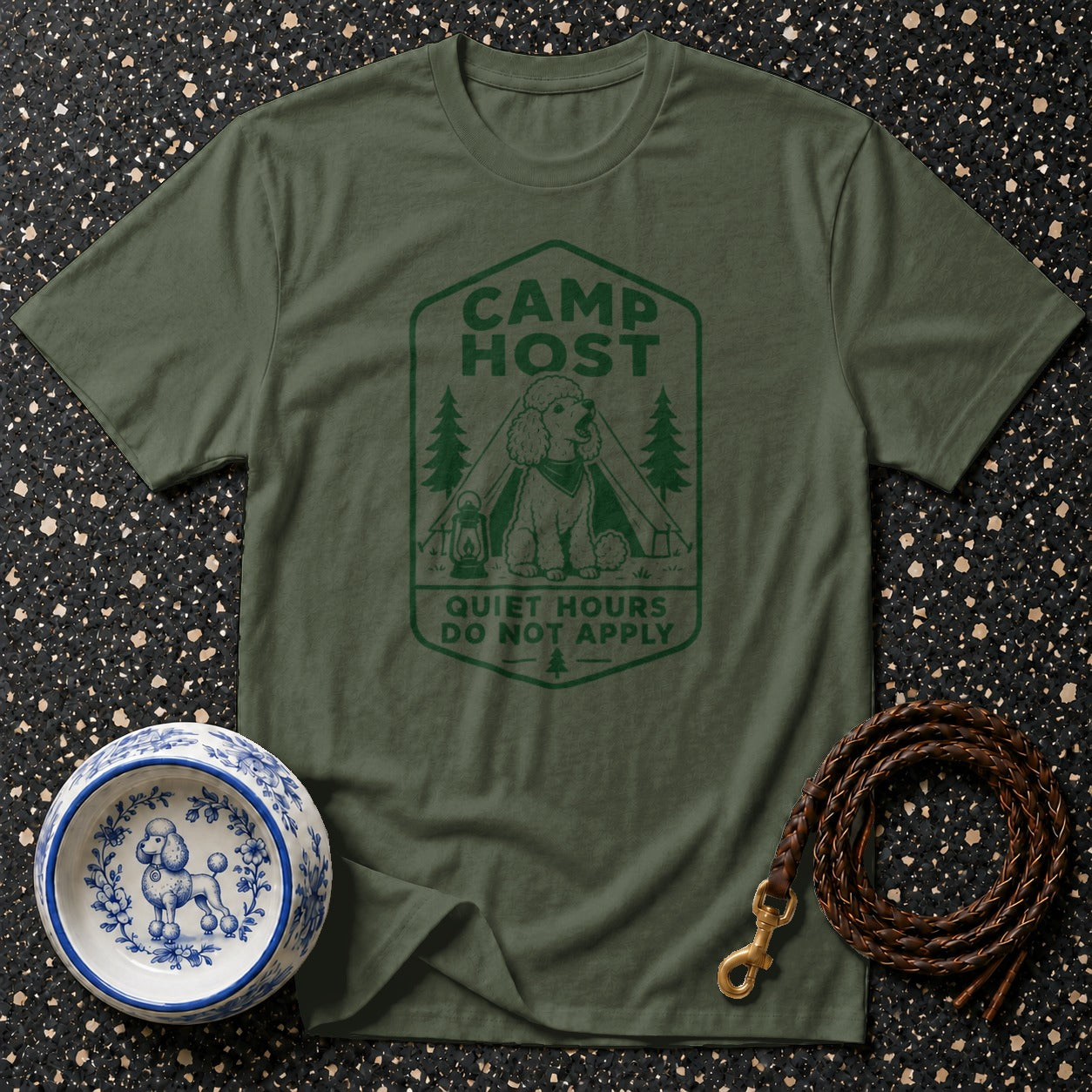 Green t-shirt with a camping scene and text "CAMP HOST QUIET HOURS DO NOT APPLY".