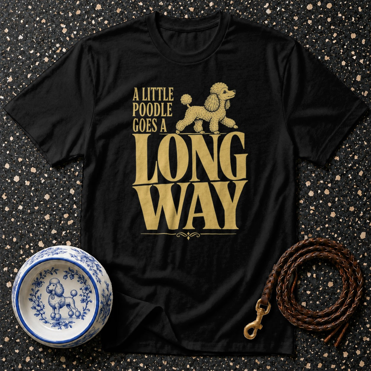Black t-shirt with gold text "A LITTLE POODLE GOES A LONG WAY" and a poodle graphic.