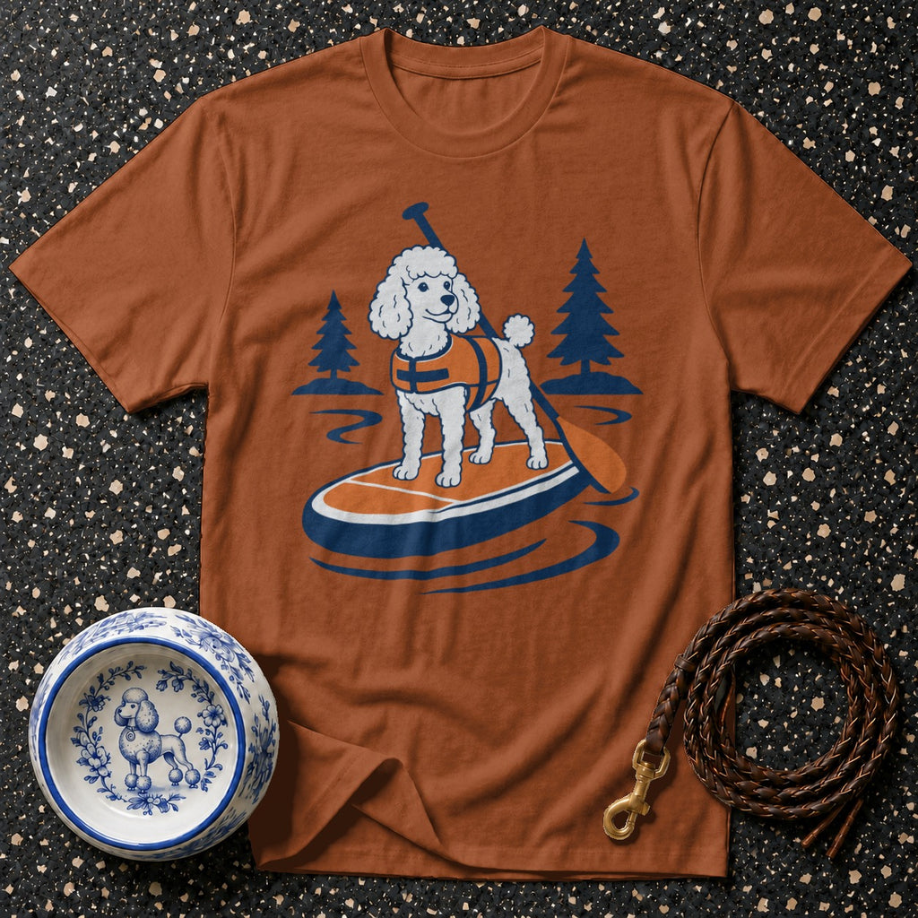 T-shirt with illustration of a white poodle on a paddleboard with a paddle.