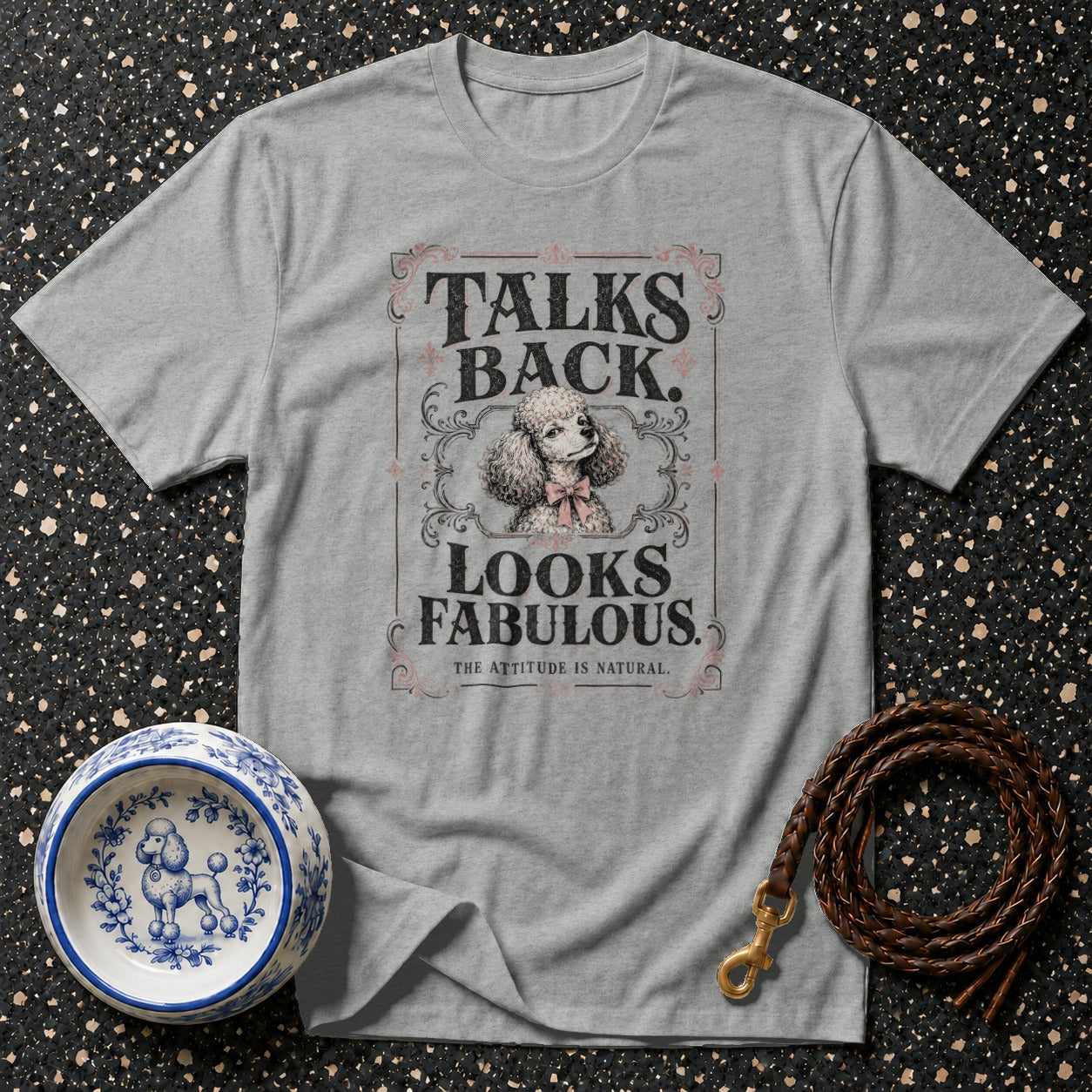 Grey t-shirt with "Talks Back. Looks Fabulous." text and a poodle illustration.