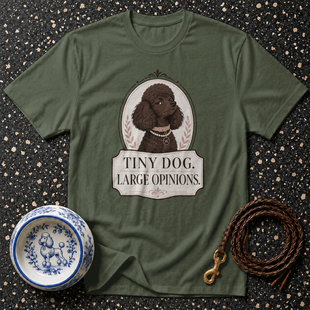 Green t-shirt with dark brown poodle illustration and text "Tiny Dog. Large Opinions."