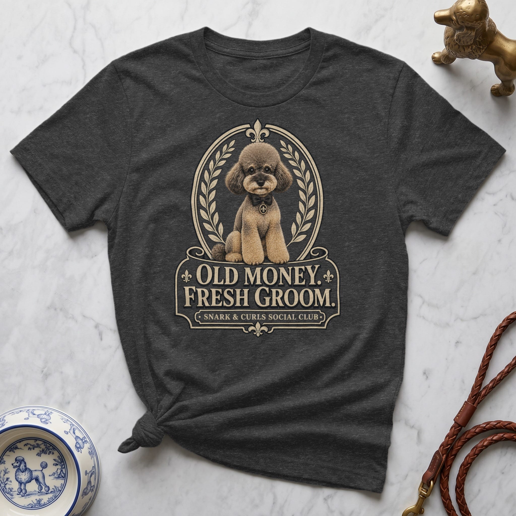 Dark gray t-shirt with "Old Money. Fresh Groom." graphic and a poodle illustration.