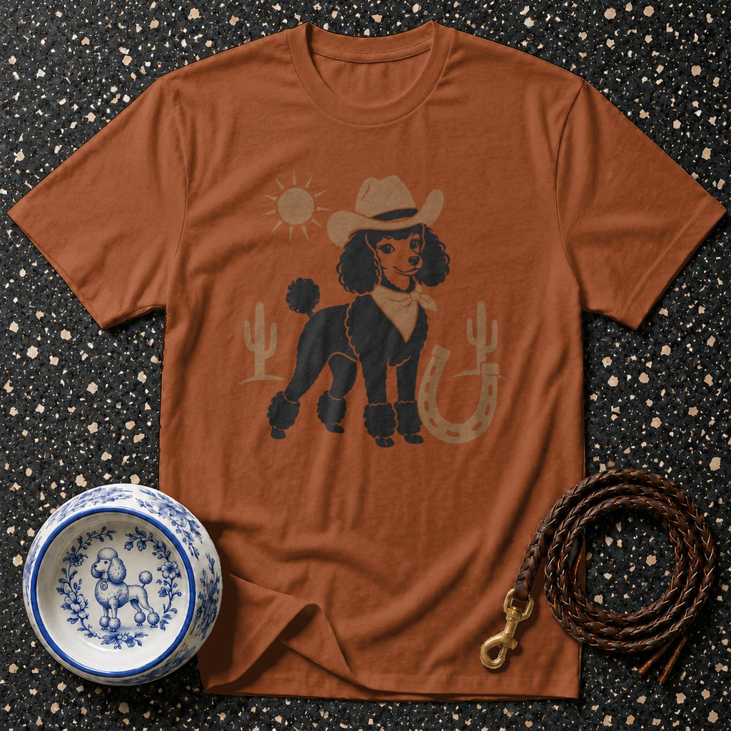 Brown t-shirt with graphic of a cowboy poodle with sun, cactus, and horseshoe.