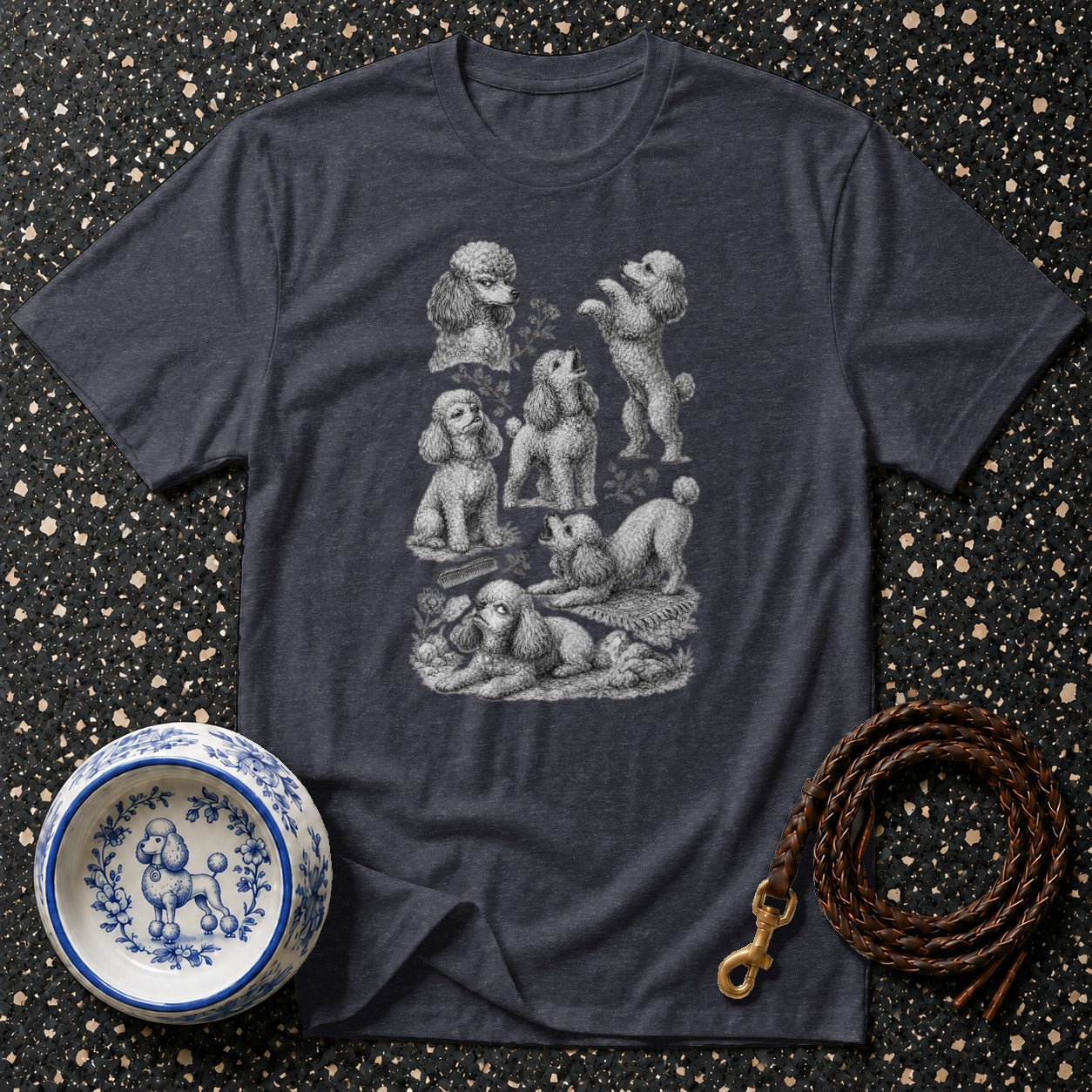 Dark grey t-shirt featuring a collection of sketched poodles and a decorative bowl with a poodle.