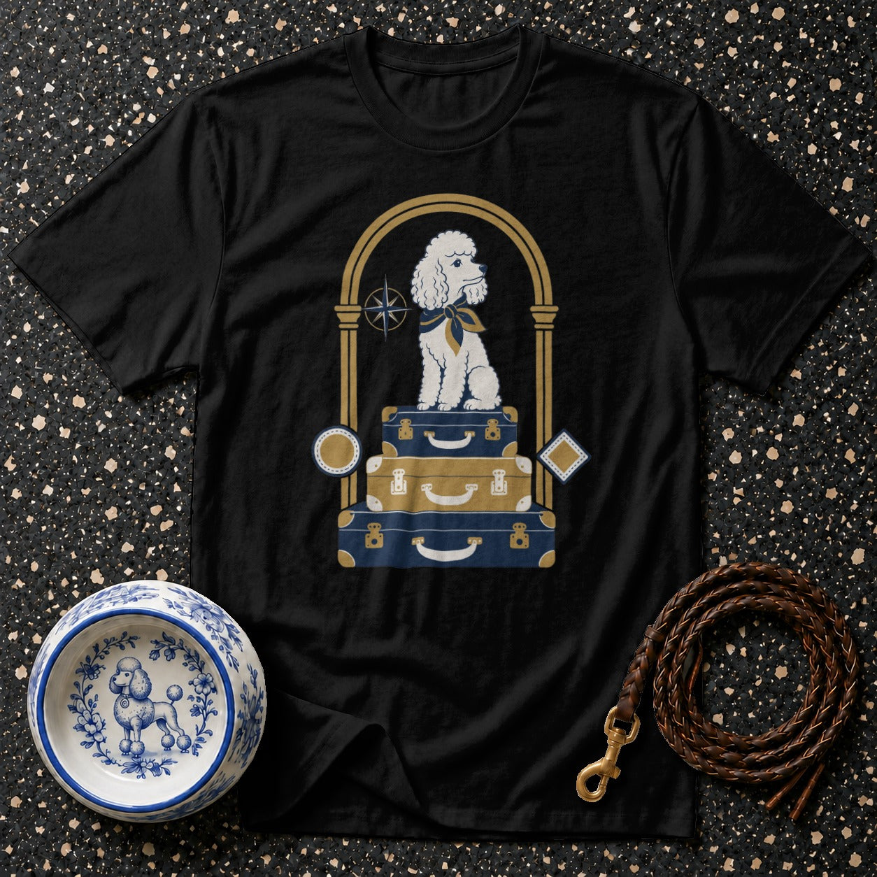 Black t-shirt with a white poodle sitting on stacked luggage.