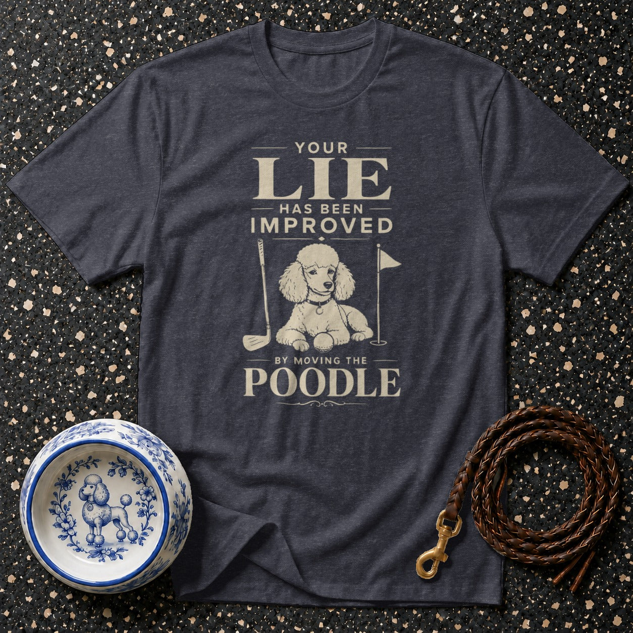 Dark blue t-shirt with a poodle on a golf course graphic and text.