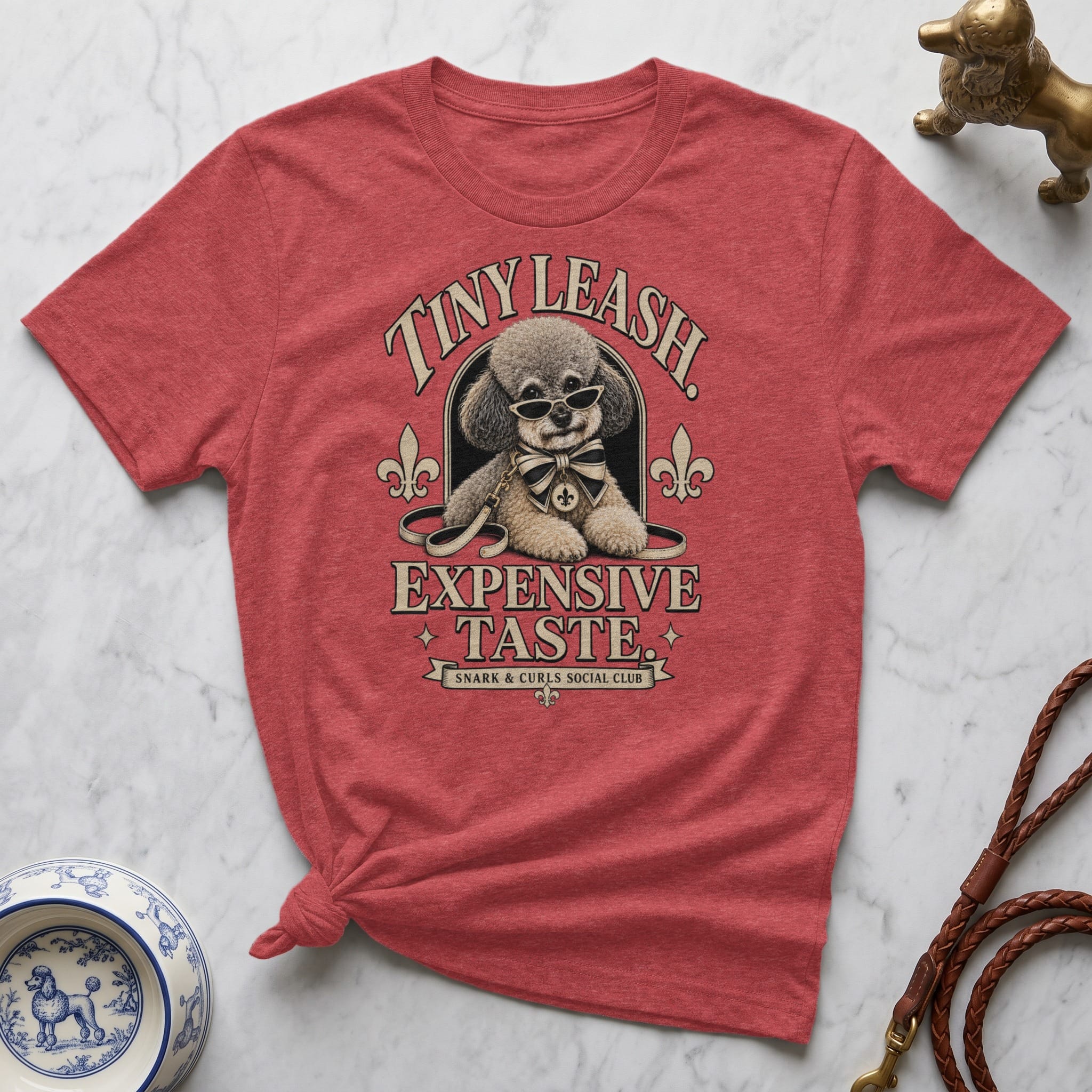 T-shirt featuring a dog in sunglasses with text "Tiny Leash. Expensive Taste."