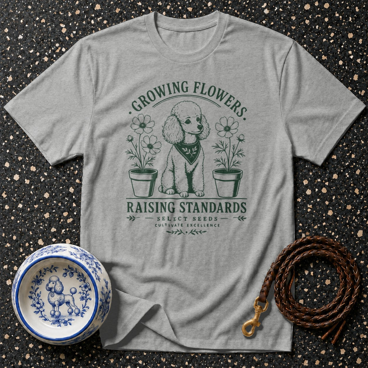 Grey t-shirt with poodle, flowers, and text "Growing Flowers. Raising Standards. Select Seeds. Cultivate Excellence."