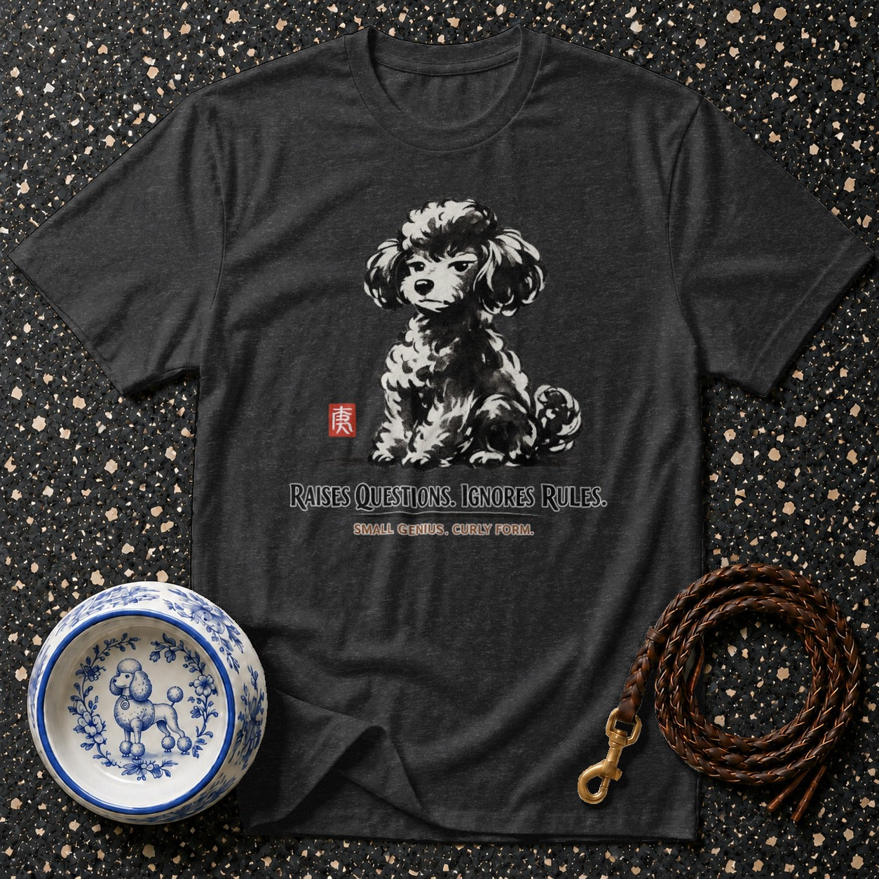 Dark grey t-shirt with a black and white poodle graphic and text: "RAISES QUESTIONS. IGNORES RULES."