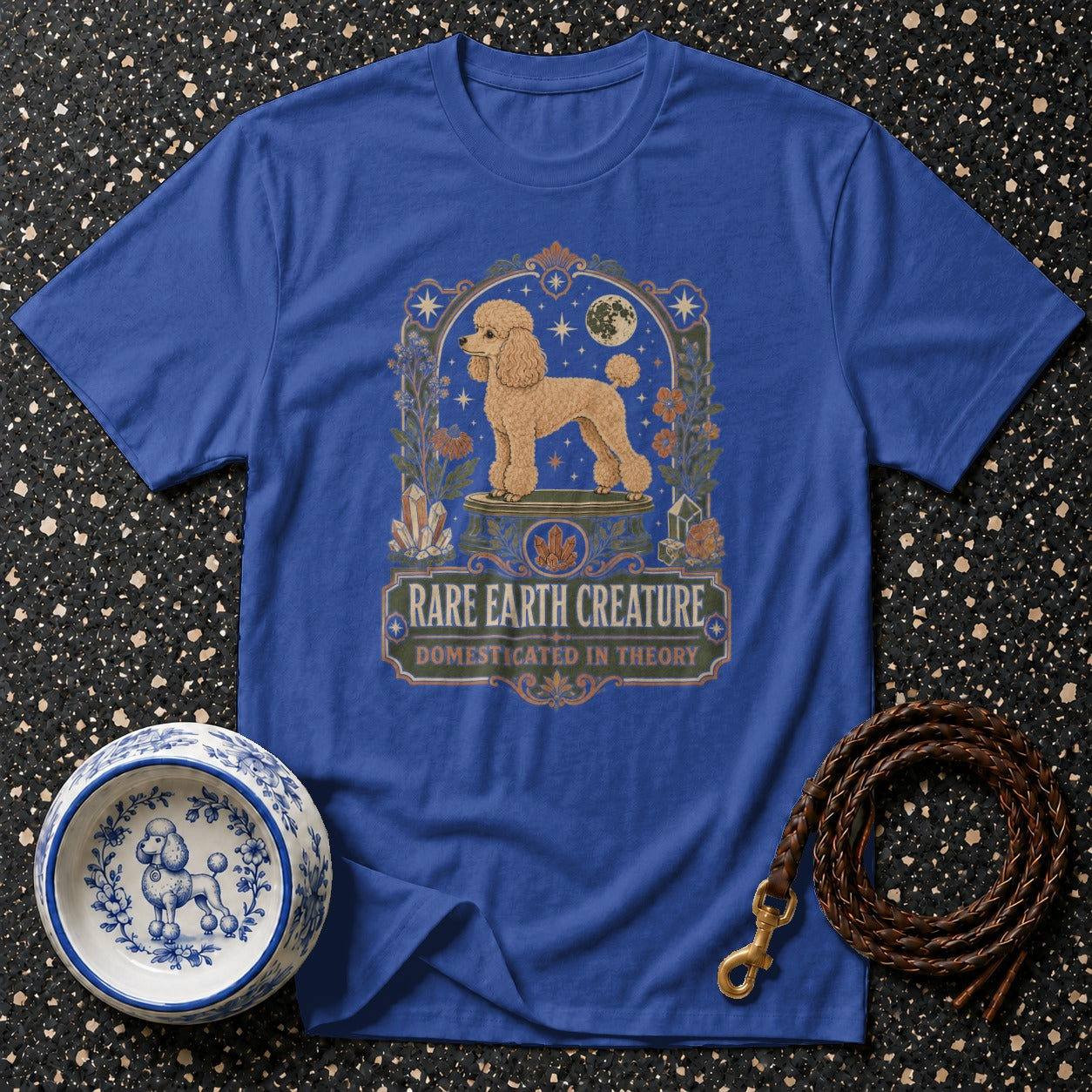 Blue t-shirt with a poodle graphic and text "RARE EARTH CREATURE DOMESTICATED IN THEORY".