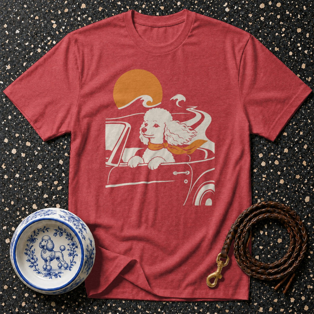 Red t-shirt with a graphic of a poodle driving a convertible at sunset.