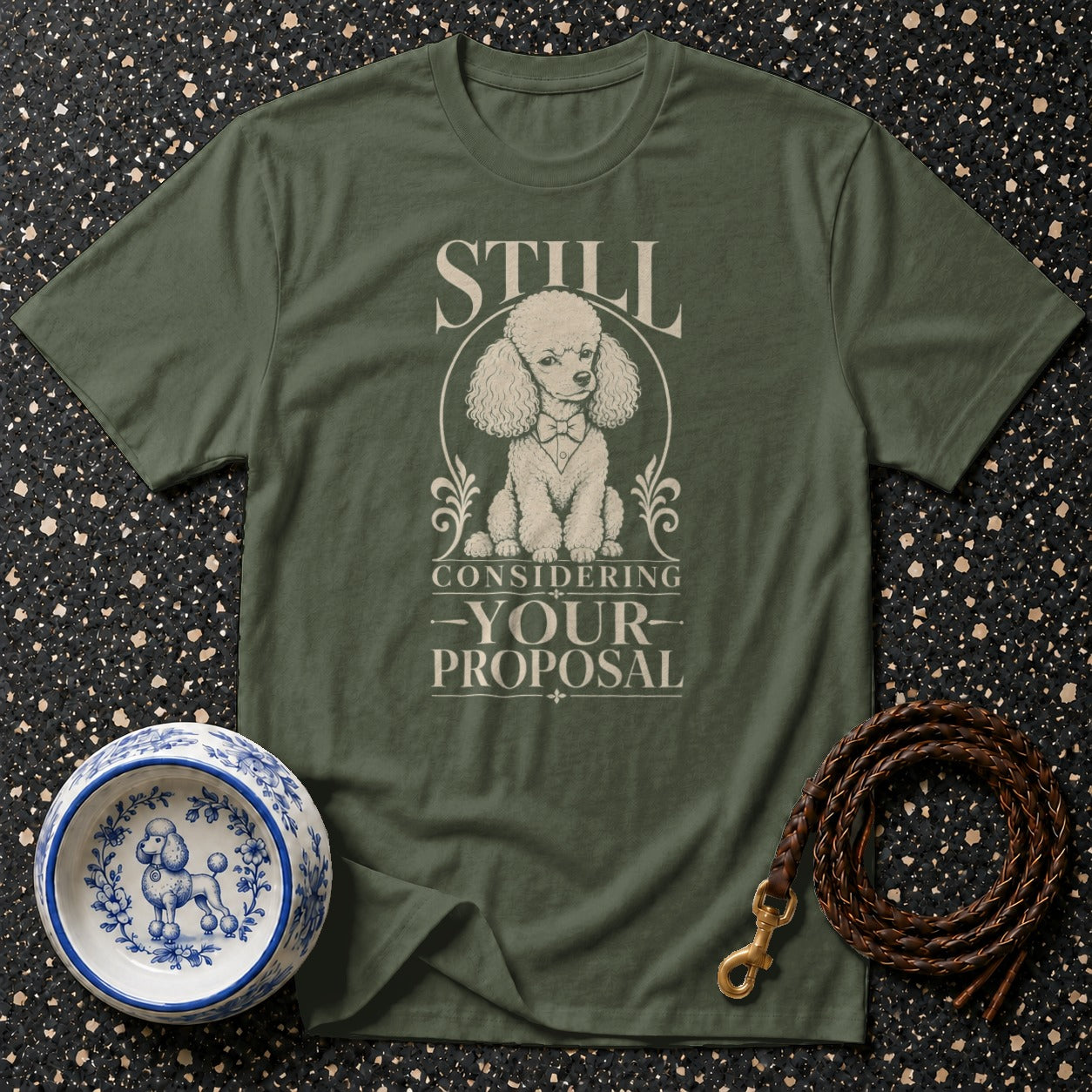 Green t-shirt with poodle graphic and text "STILL CONSIDERING -YOUR- PROPOSAL."