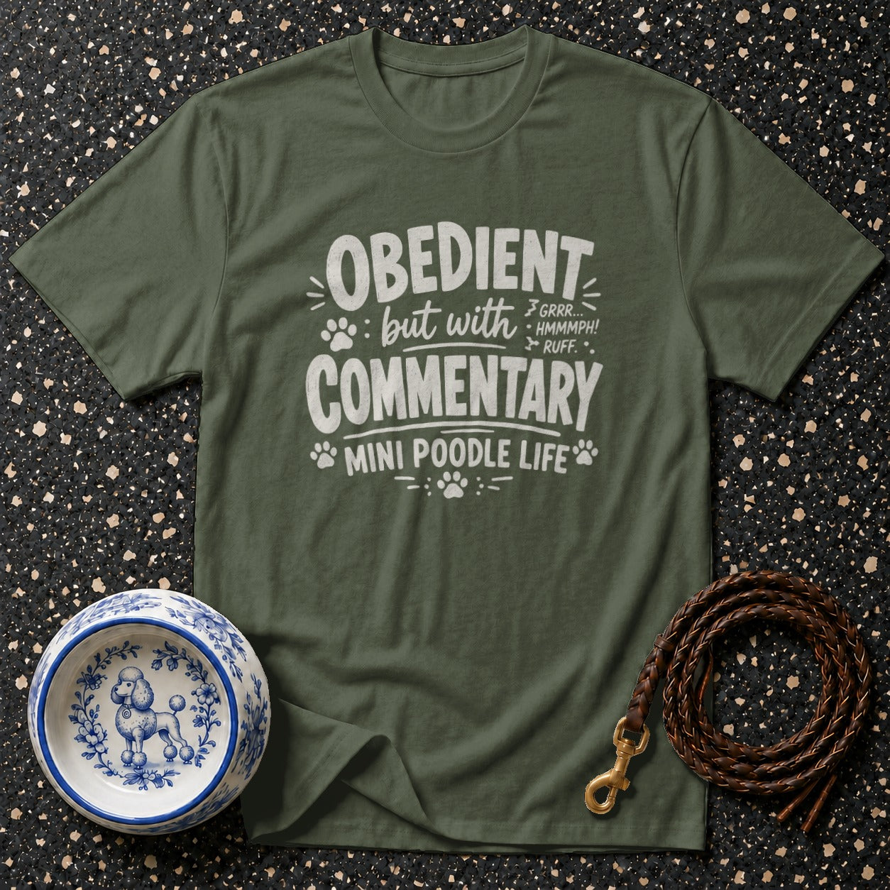 Green t-shirt with white text: "Obedient but with commentary" and "Mini Poodle Life."