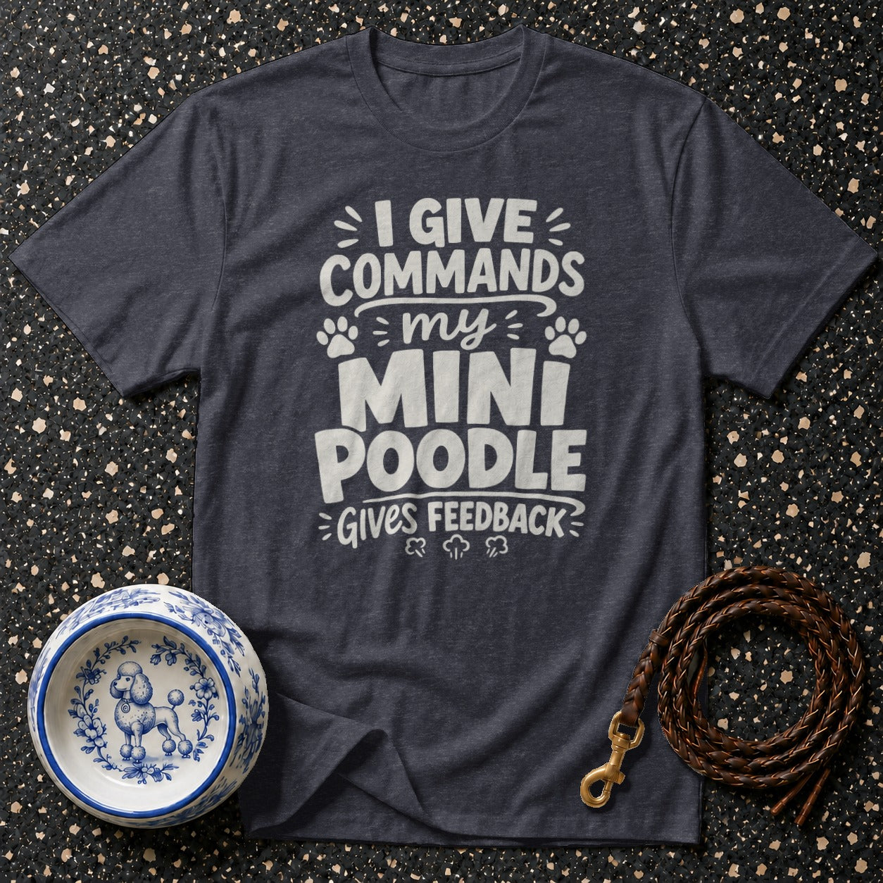 Dark grey t-shirt with white text "I give commands my mini poodle gives feedback".