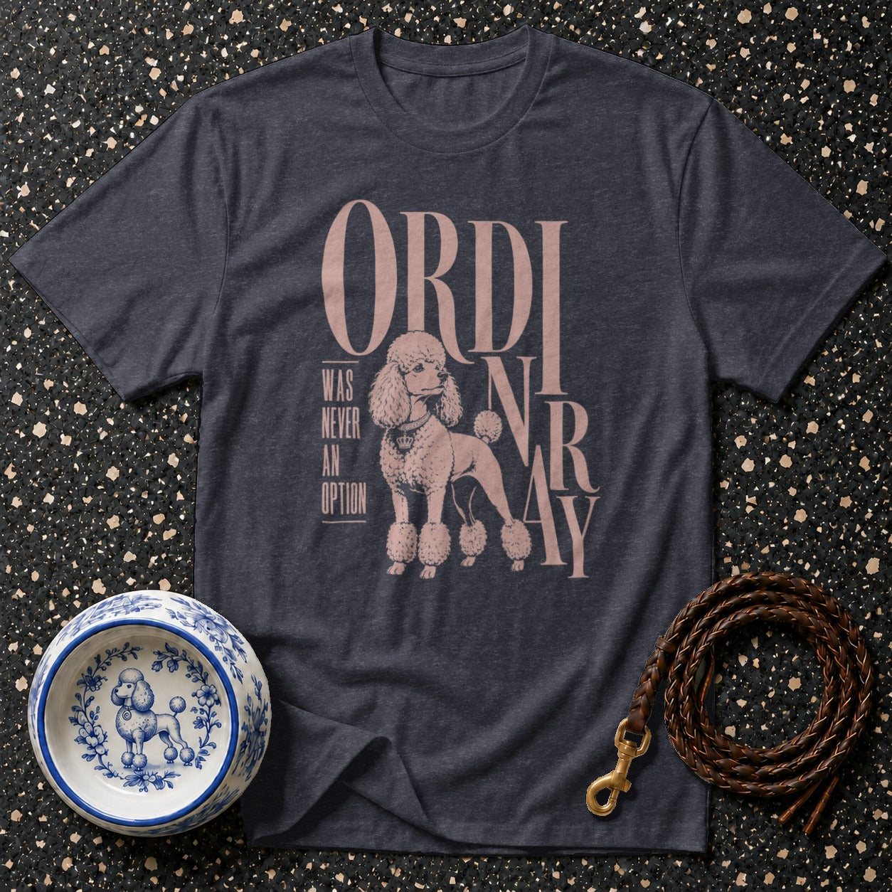 Dark gray t-shirt with poodle graphic and "ORDINARY WAS NEVER AN OPTION" text.
