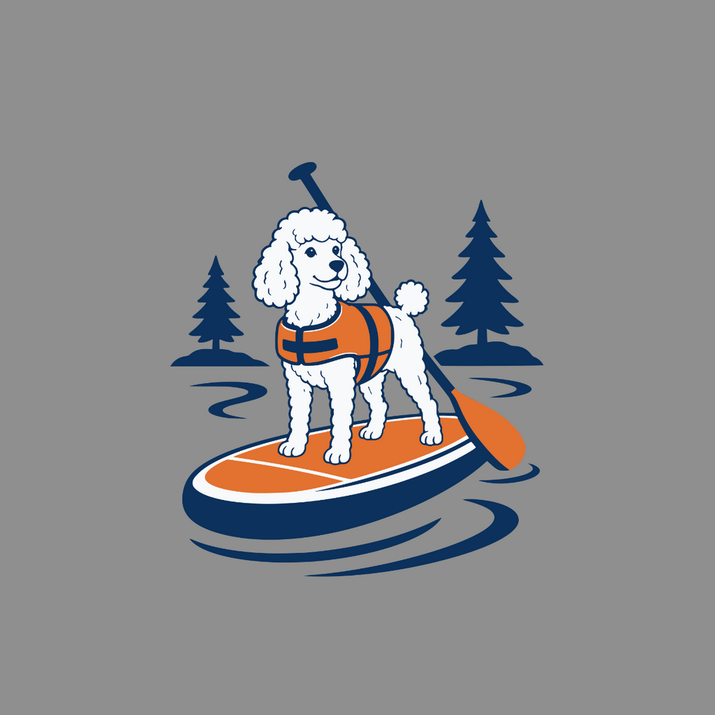 White poodle with orange life vest on a paddleboard with trees.