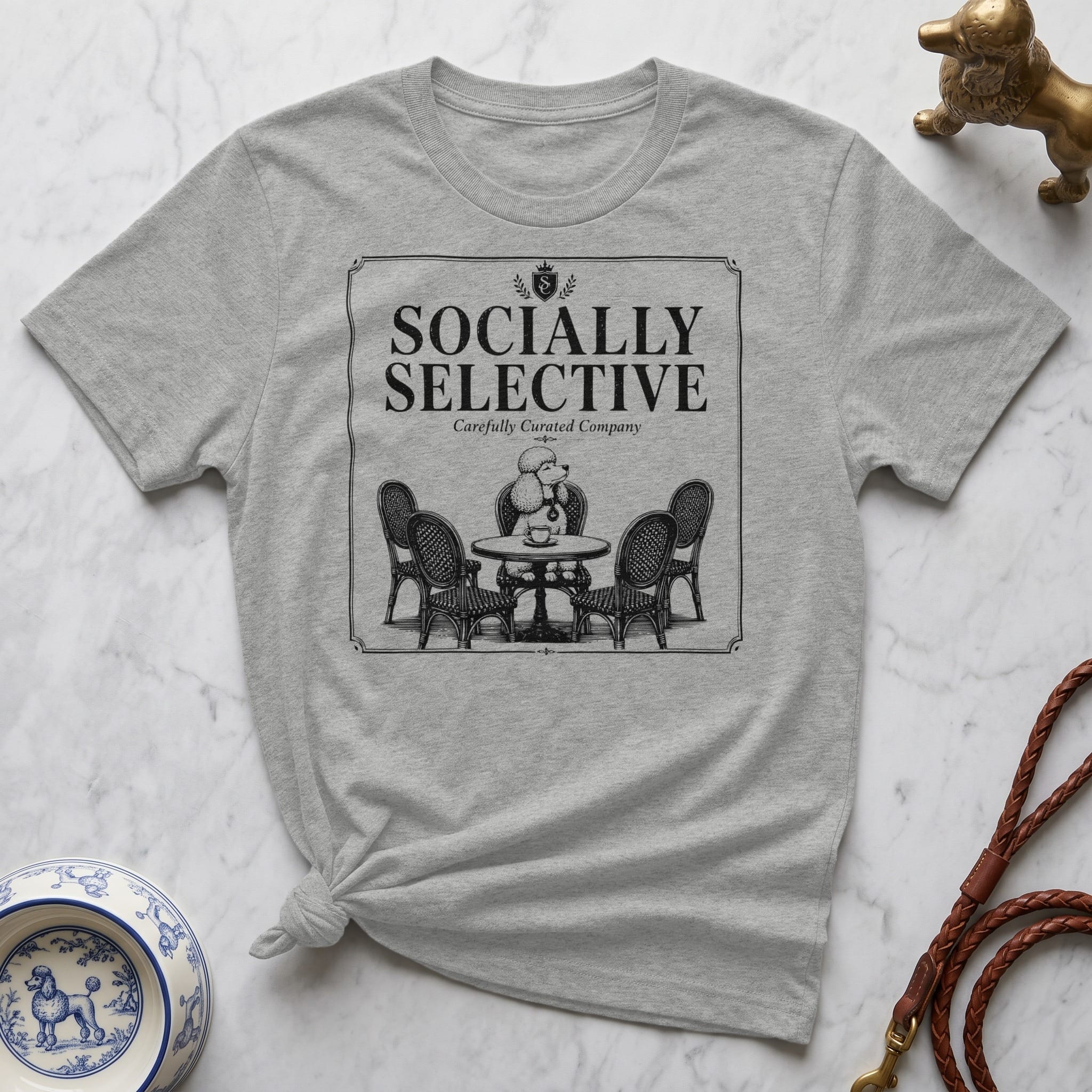 Grey t-shirt with "Socially Selective" and poodle illustration.