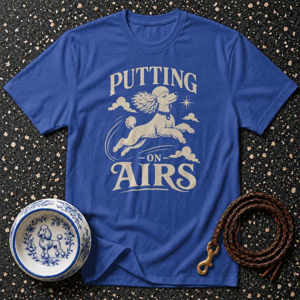 Royal blue t-shirt with a poodle graphic and text "Putting on Airs".