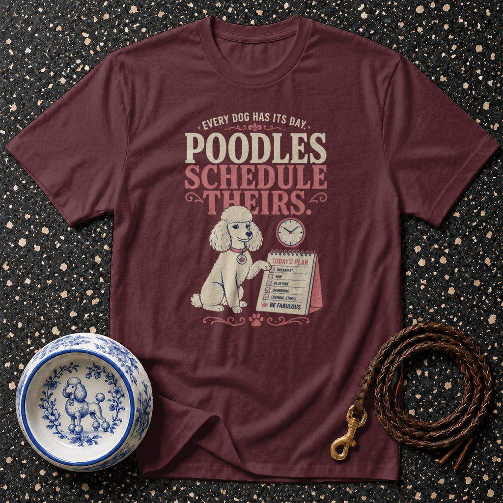 Maroon t-shirt with poodle graphic and "Poodles Schedule Theirs" text.