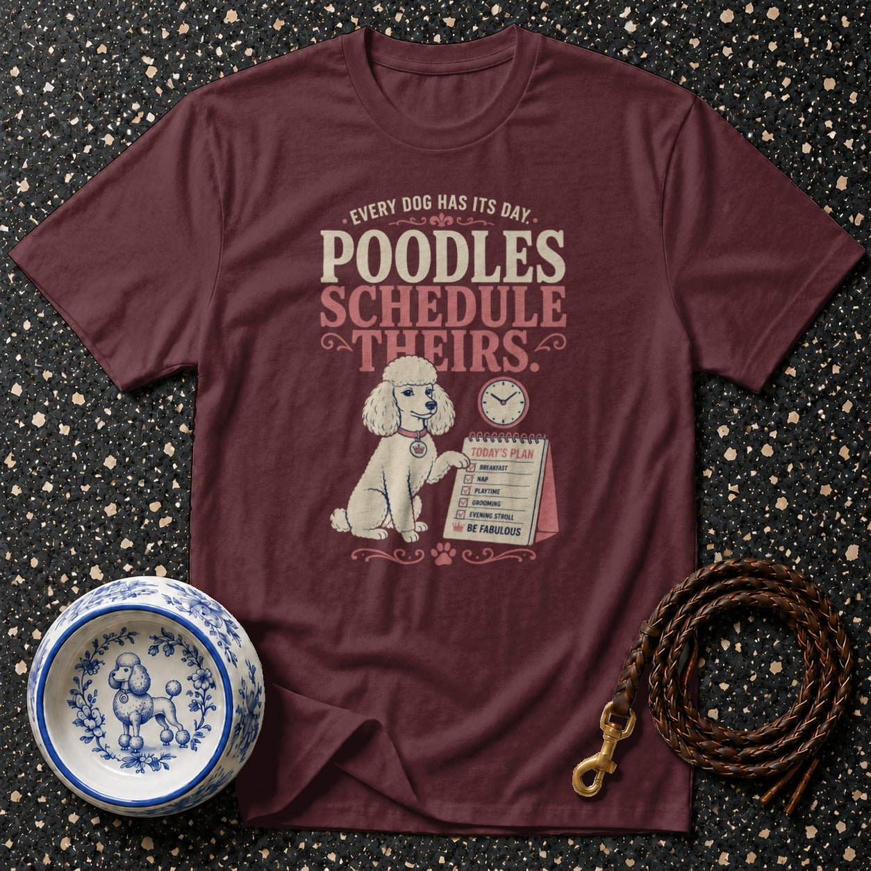 Maroon t-shirt with poodle graphic and "Poodles Schedule Theirs" text.