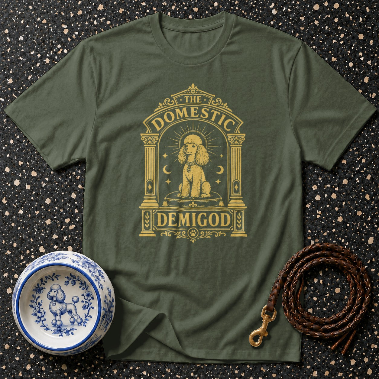 Green t-shirt with "The Domestic Demigod" text and poodle graphic.