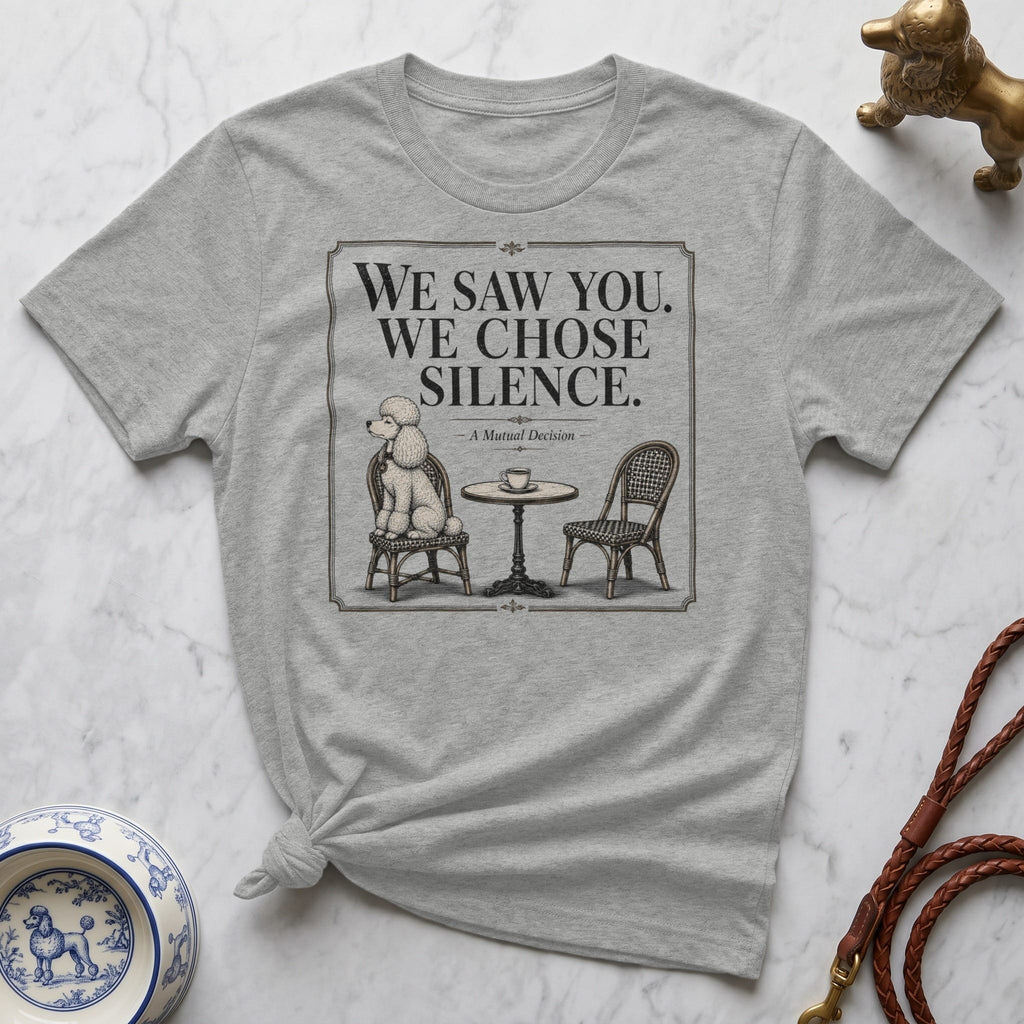 T-shirt with illustration of a poodle sitting at a table with a chair.