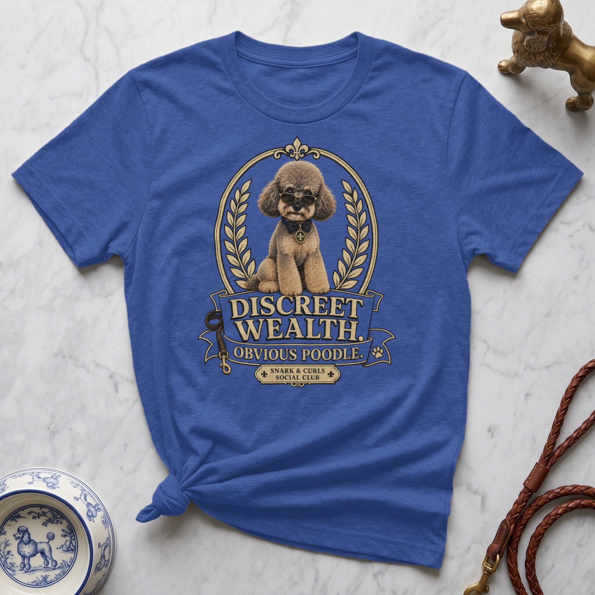 Royal blue t-shirt with "Discreet Wealth Obvious Poodle" text and poodle graphic.