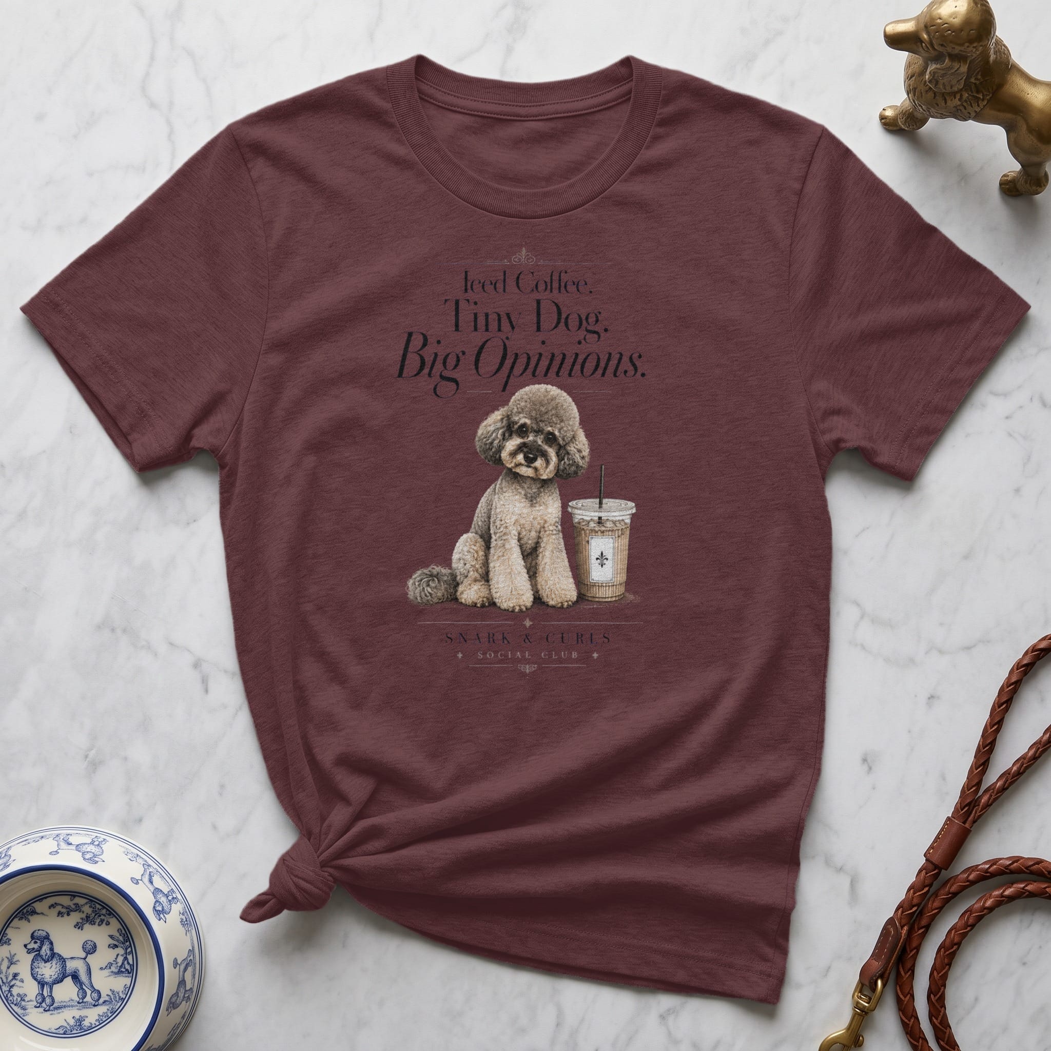 Maroon t-shirt with "Iced Coffee. Tiny Dog. Big Opinions." graphic.